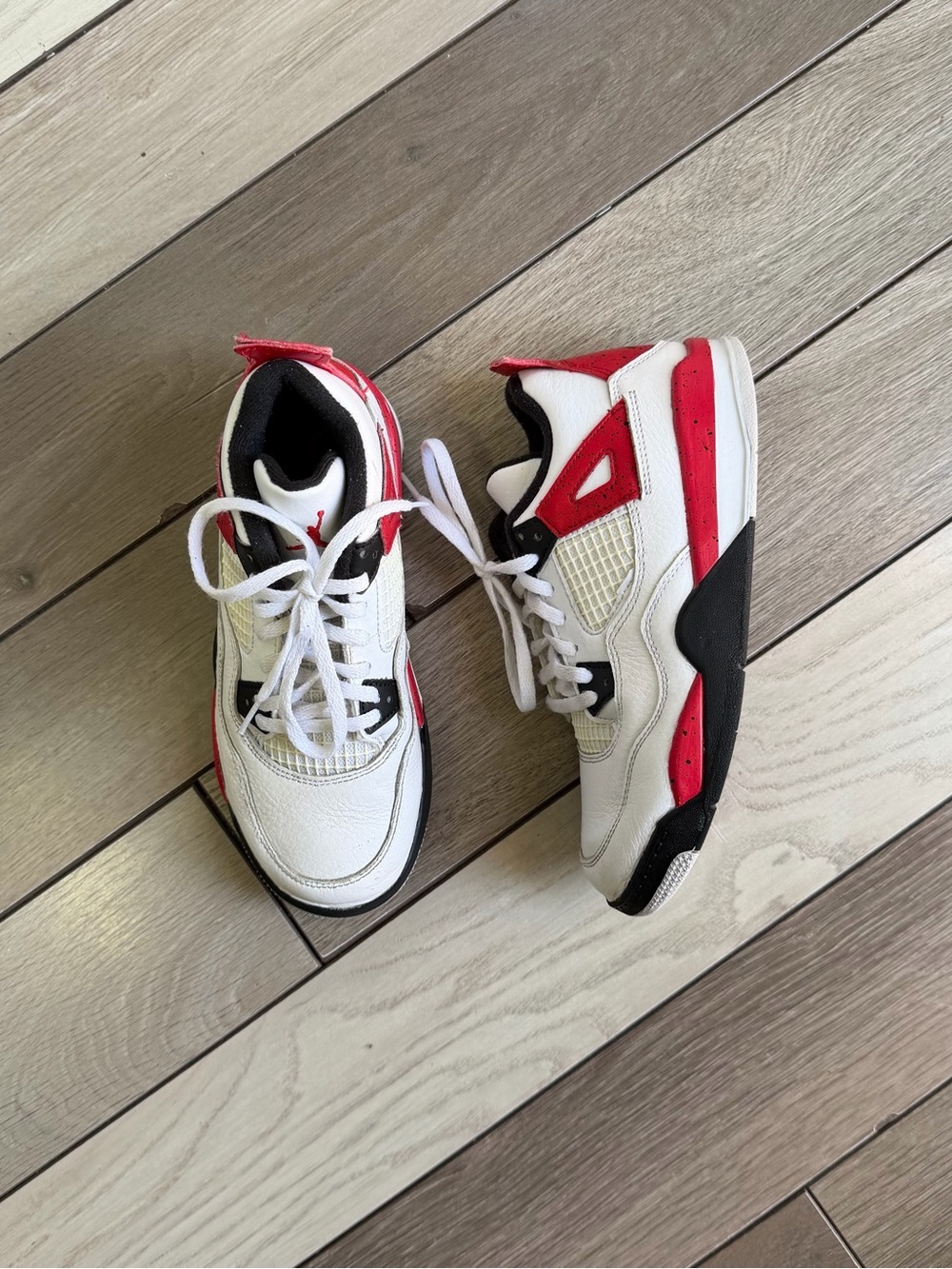 Air Jordan 4 Retro "Red Cement" sneakers for youth